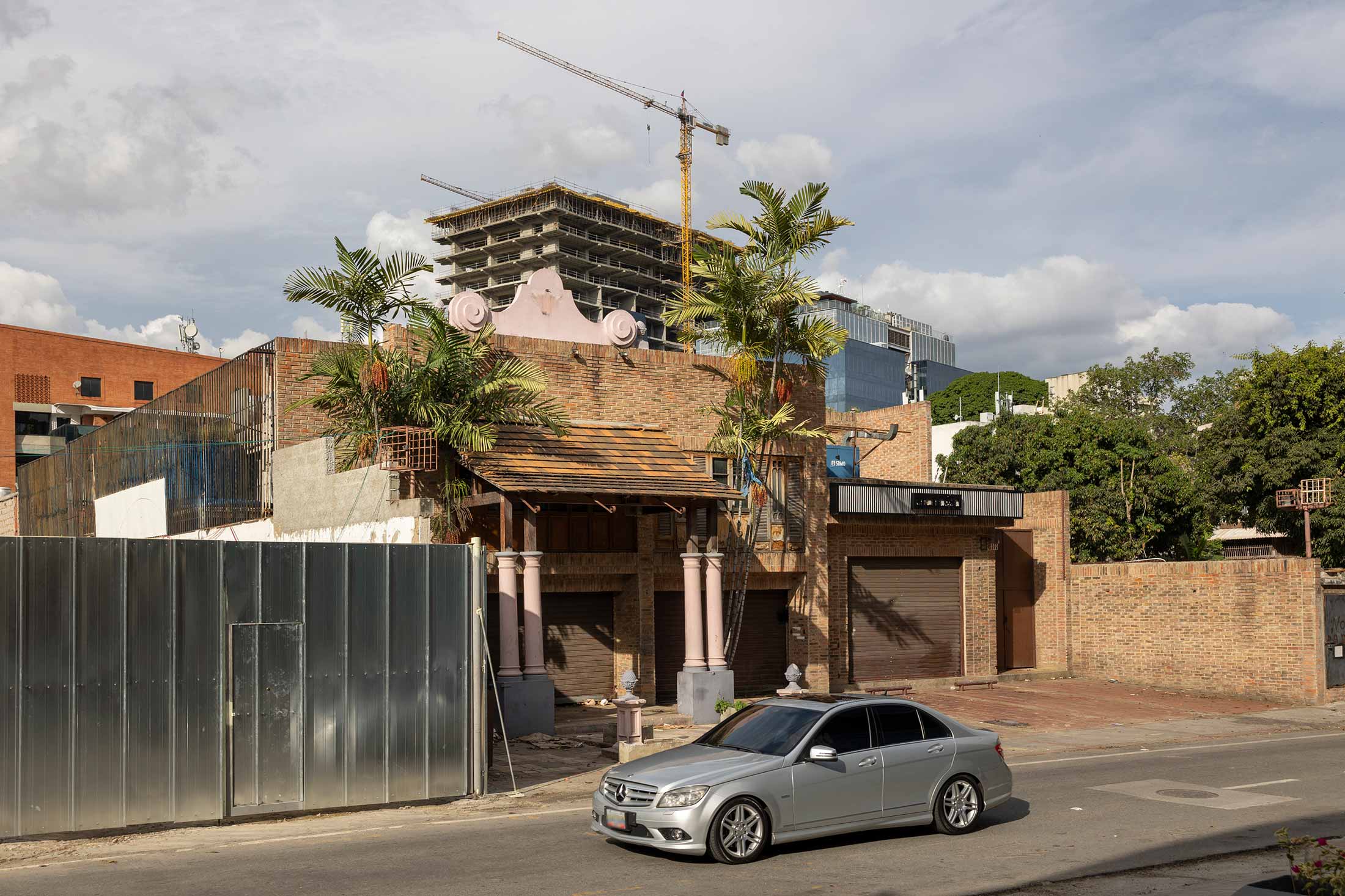 Luxury cars and construction sites are common sights in Las Mercedes.Photographer: Fabiola Ferrero for Bloomberg Markets