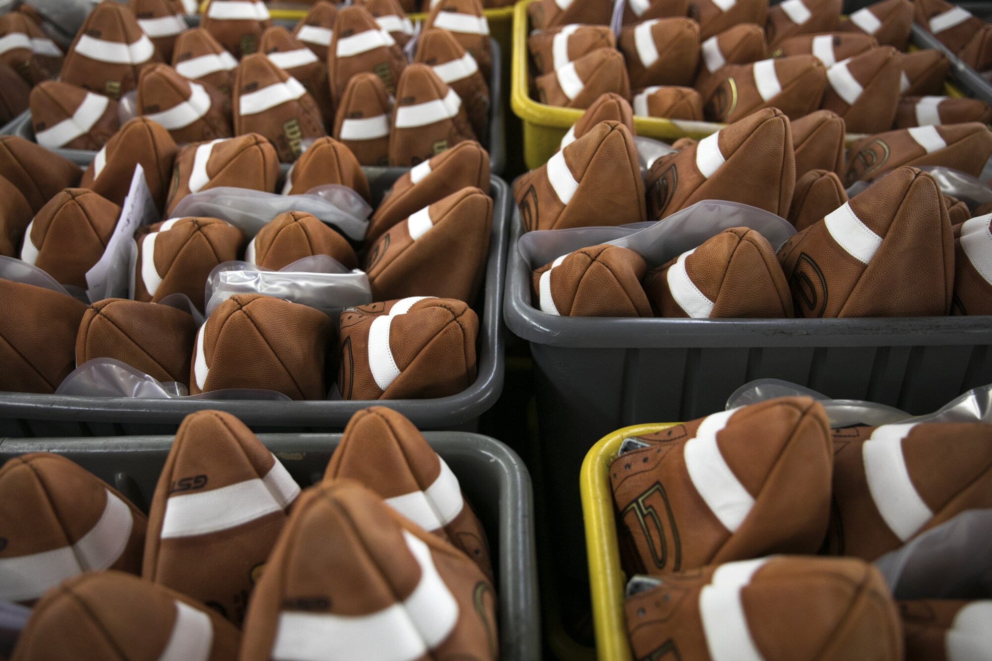 Bins of footballs at the Wilson Sporting Goods facility in Ada, Ohio.Photographer: Maddie McGarvey/Bloomberg
