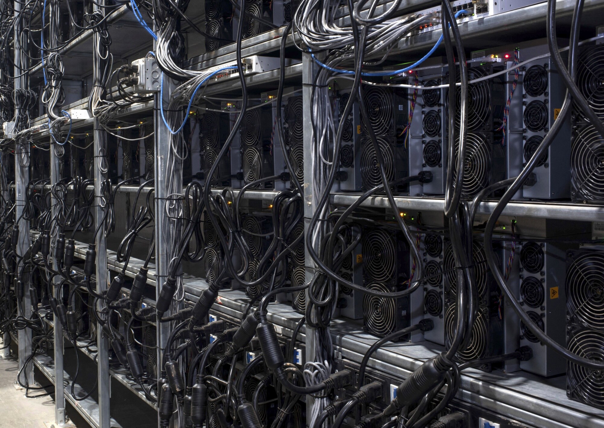 Bitcoin mining machines in a warehouse at the Whinstone US Bitcoin mining facility in Rockdale, Texas.Photographer: Mark Felix/AFP/Getty Images