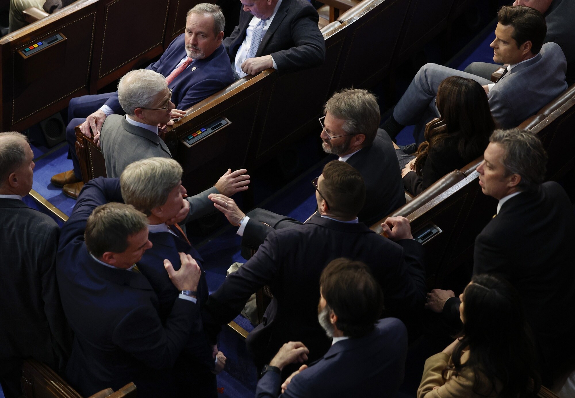 Mike Rogers is restrained by Richard Hudson after getting into an argument with Matt Gaetz on Jan. 6Photographer: Chip Somodevilla/Getty Images