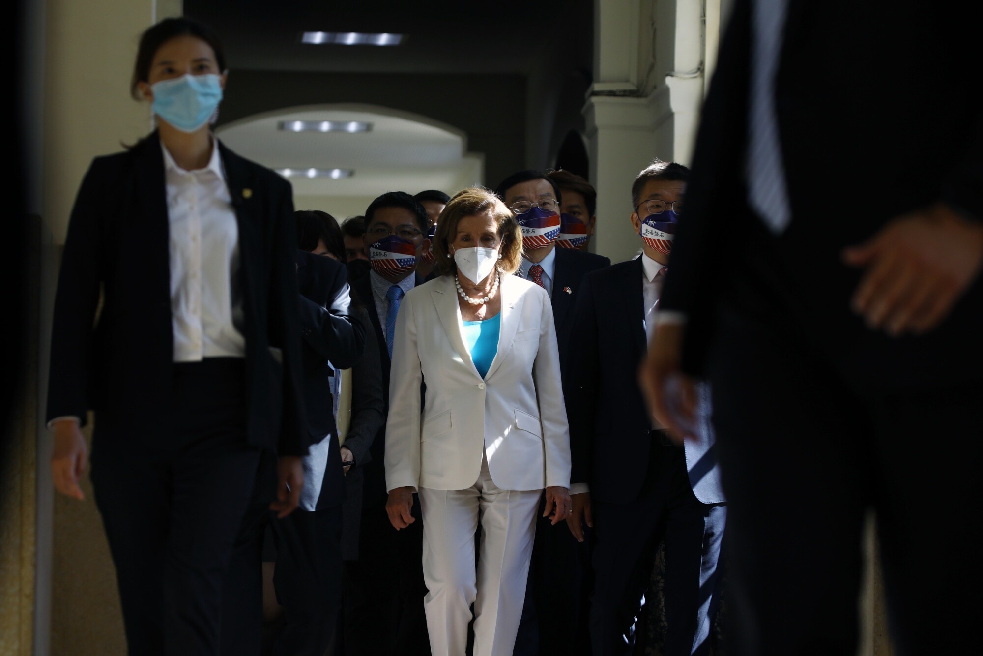 Nancy Pelosi, center, arrives at the Legislative Yuan in Taipei, Taiwan, in Aug. 2022. Photographer: I-Hwa Cheng/Bloomberg