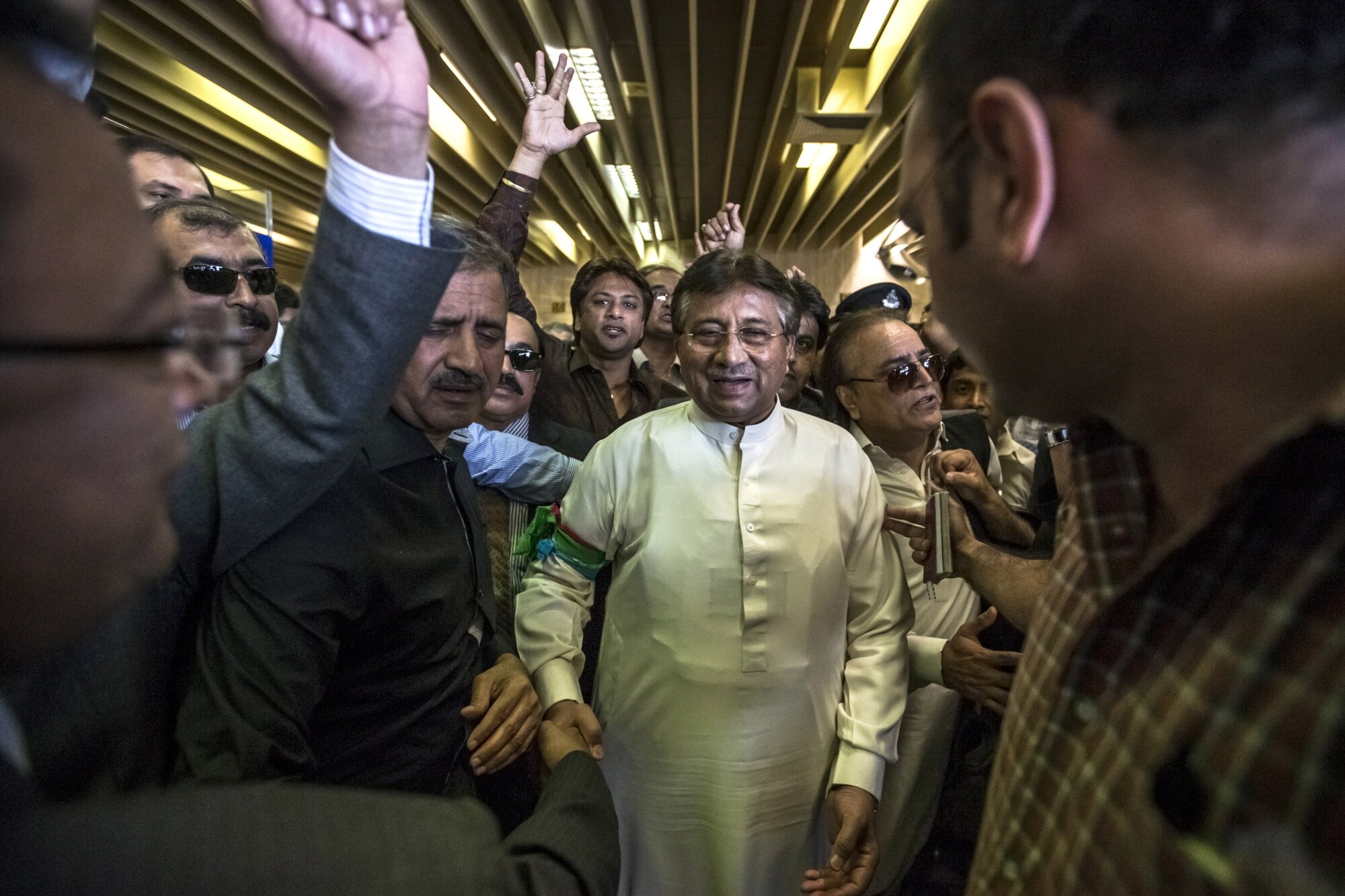 Pervez Musharraf is greeted by supporters after landing at Jinnah International airport in Karachi in 2013.Photographer: Daniel Berehulak/Getty Images