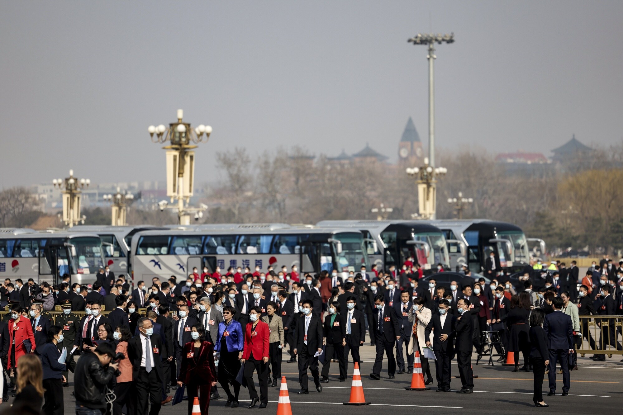 Delegates arrive at the Great Hall of the People before the opening of the first session of the 14th Chinese People's Political Consultative Conference (CPPCC) on March 4.Photographer: Lintao Zhang/Getty Images