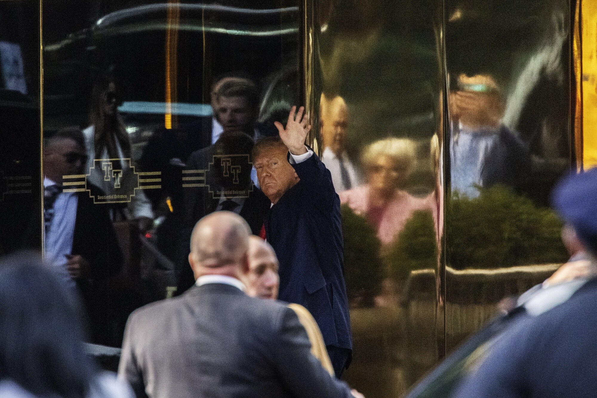 Donald Trump, center, arrives at Trump Tower in New York on April 3.Photographer: Victor J. Blue/Bloomberg