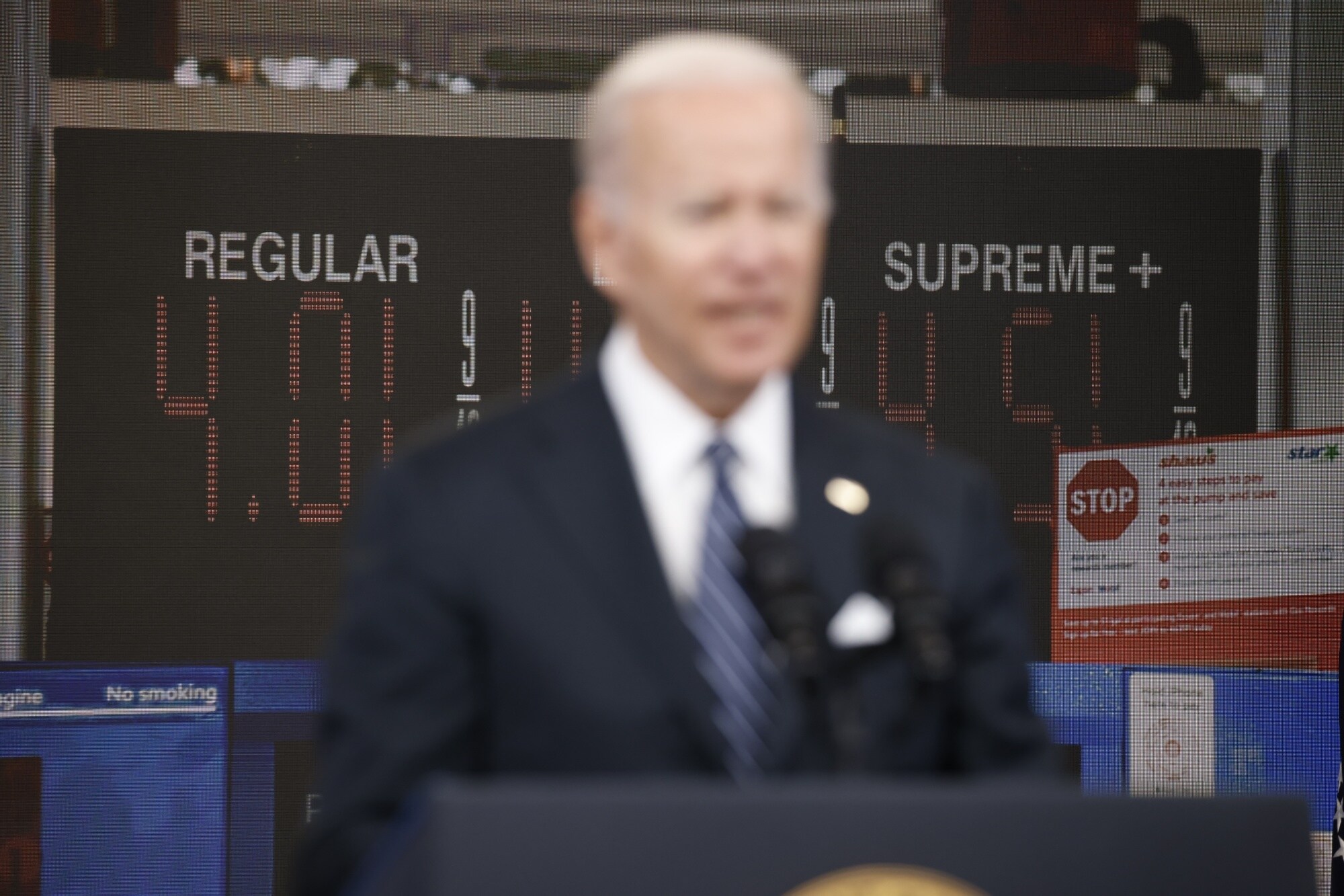 President Biden speaks in front of a monitor with fuel prices.Photographer: Samuel Corum/Bloomberg