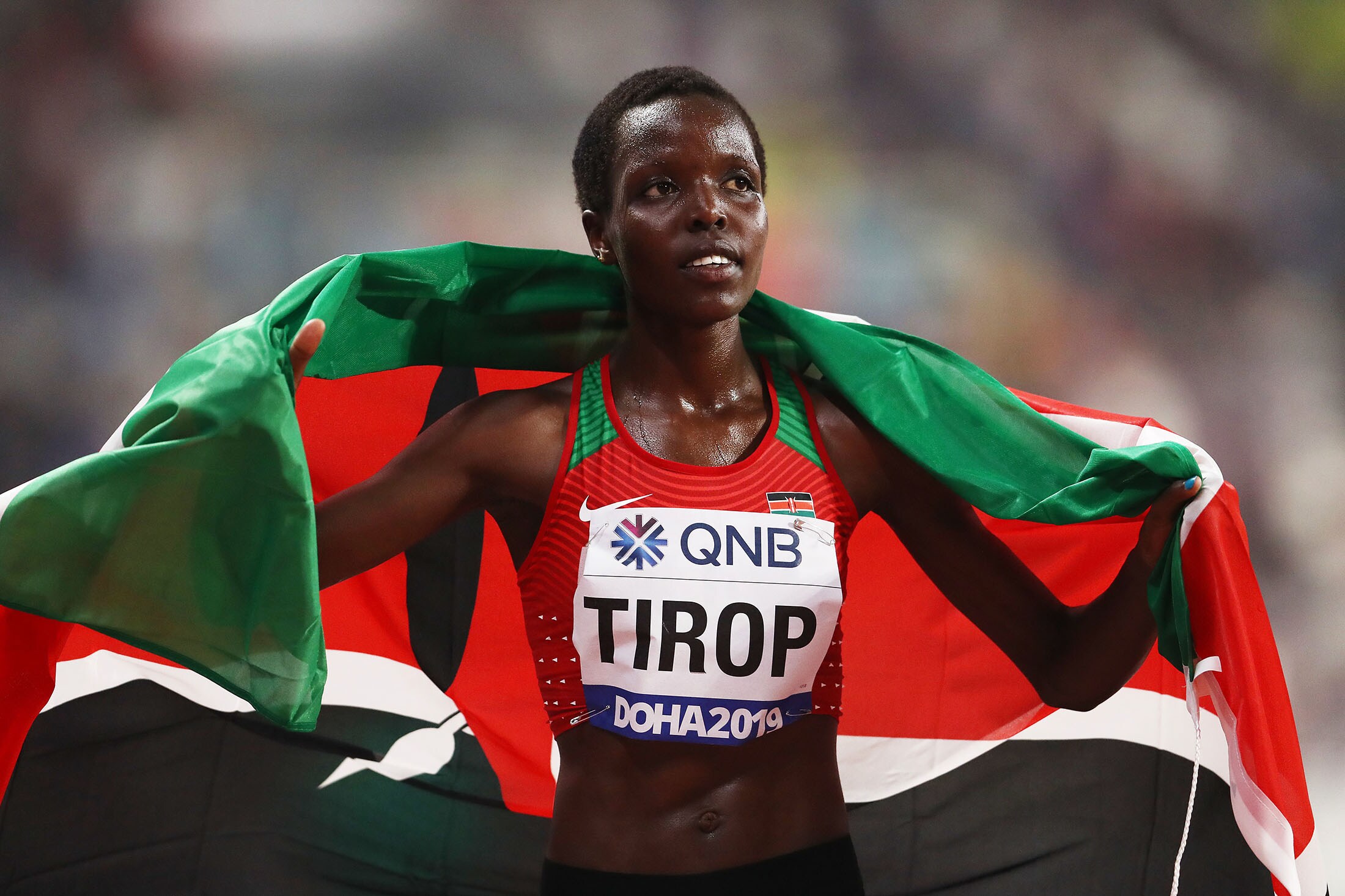 Tirop celebrates winning a bronze medal in the women's 10,000-meter final at the World Athletics Championships in Doha in September 2019.Photographer: Alexander Hassenstein/Getty Images