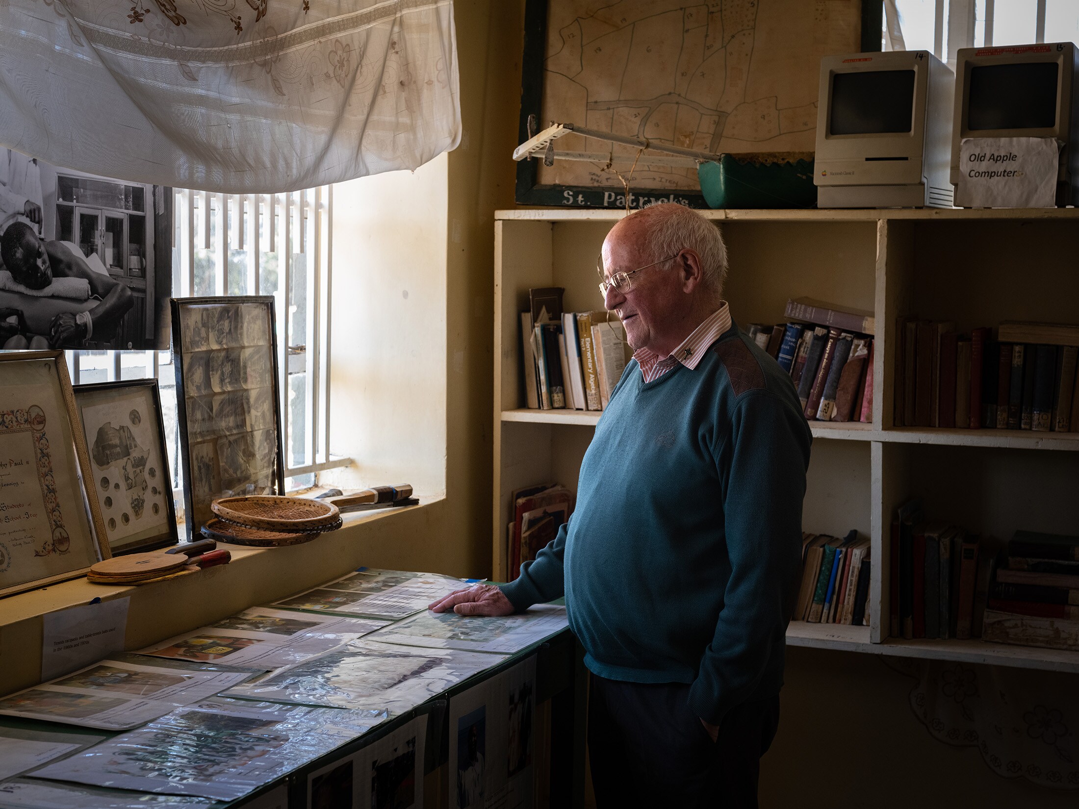 Colm O'Connell, an Irish missionary and coach known as “the godfather of Kenyan running,” stands in a museum at St. Patrick's High School in Iten. Photographer: Nichole Sobecki/Bloomberg