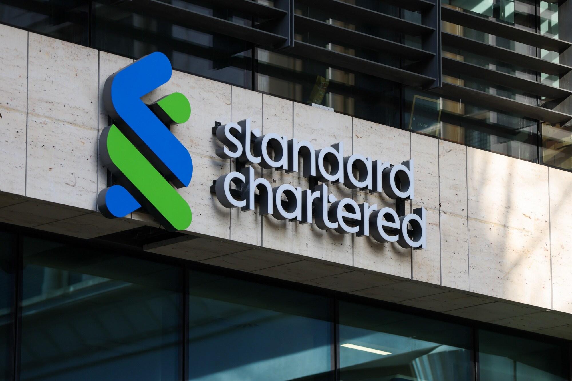 A Standard Chartered logo at the company's headquarters in London on Feb. 9.Photographer: Hollie Adams/Bloomberg