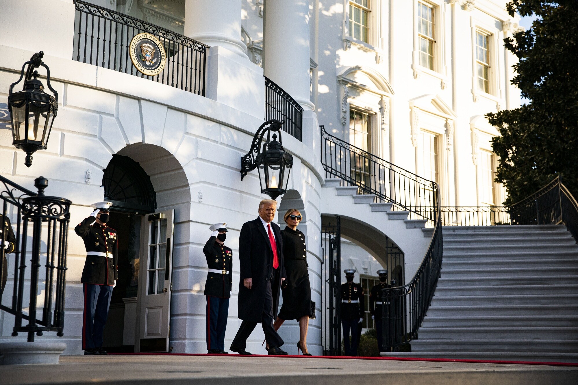 Donald and Melania Trump exit the White House on Jan. 20, 2021.Photographer: Al Drago/Bloomberg