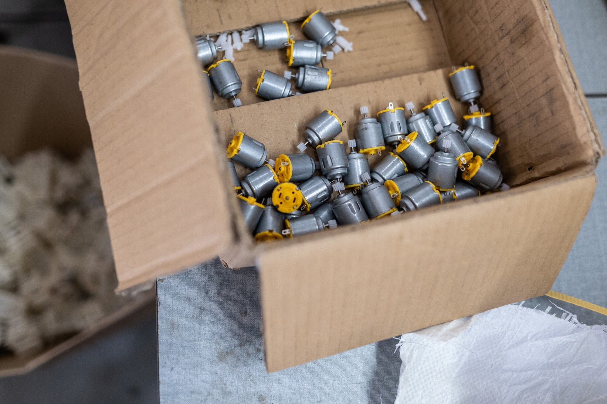 Parts to be assembled into electronic toys at the Fun Zoo Toys factory.Photographer:Anindito Mukherjee/Bloomberg