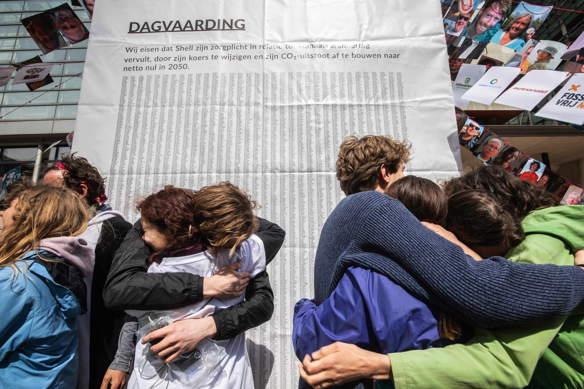 Environmentalists celebrate after a Dutch court ordered Shell to slash its emissions harder and faster than planned, in The Hague in May 2021.Photographer: Peter Boer/Bloomberg