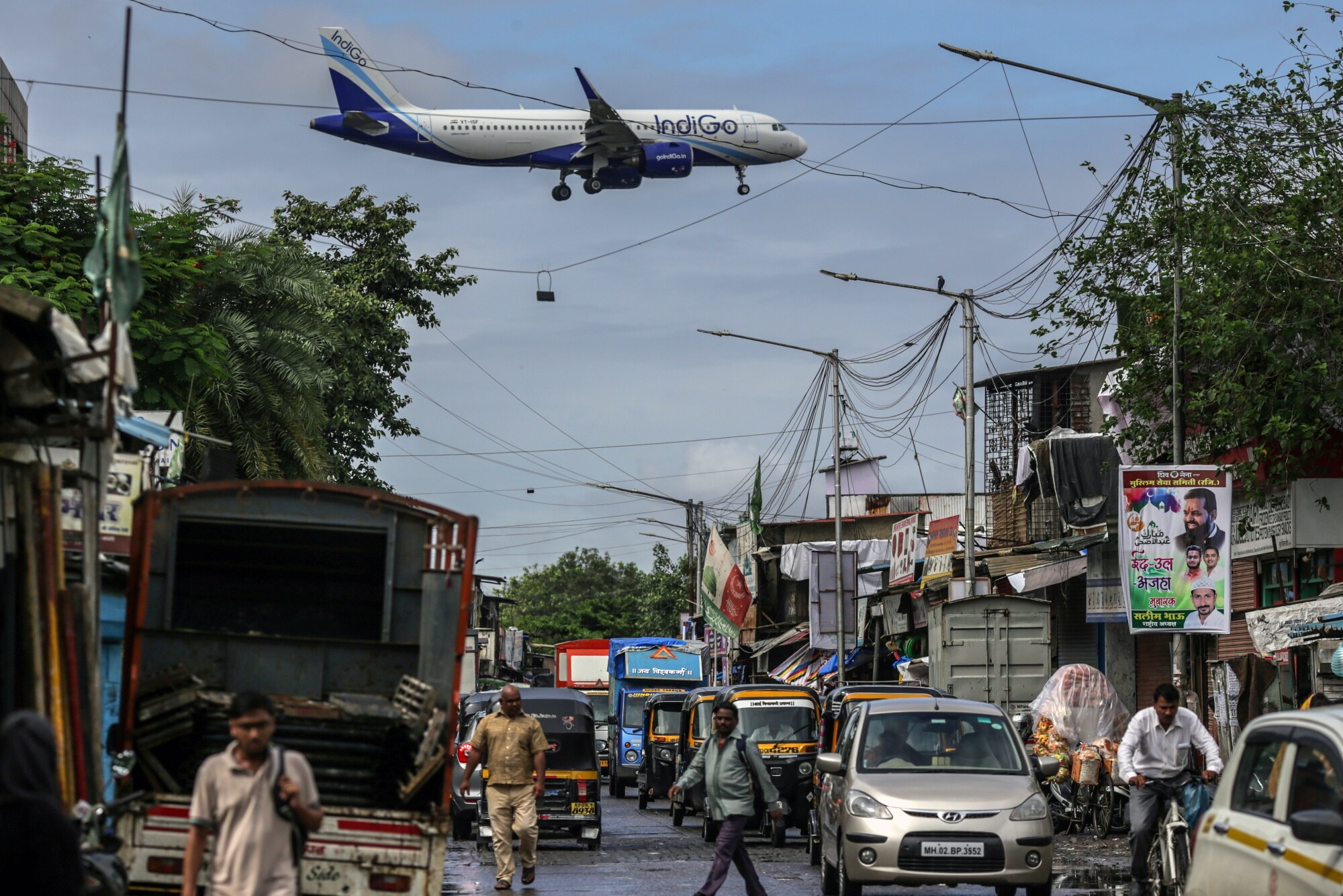 An IndiGo aircraft prepares to land at Mumbai's airport.Photographer: Dhiraj Singh/Bloomberg