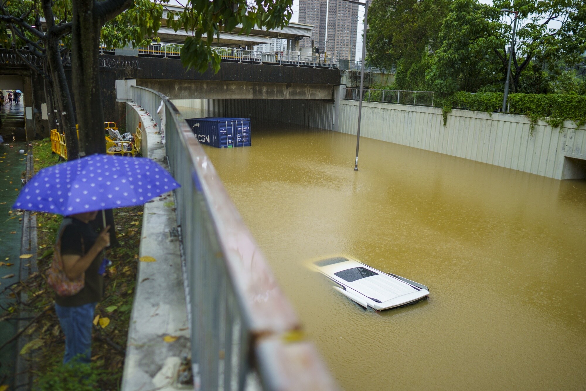 Submerged vehicles in the Tai Po area of Hong Kong.Photographer: Justin Chin/Bloomberg