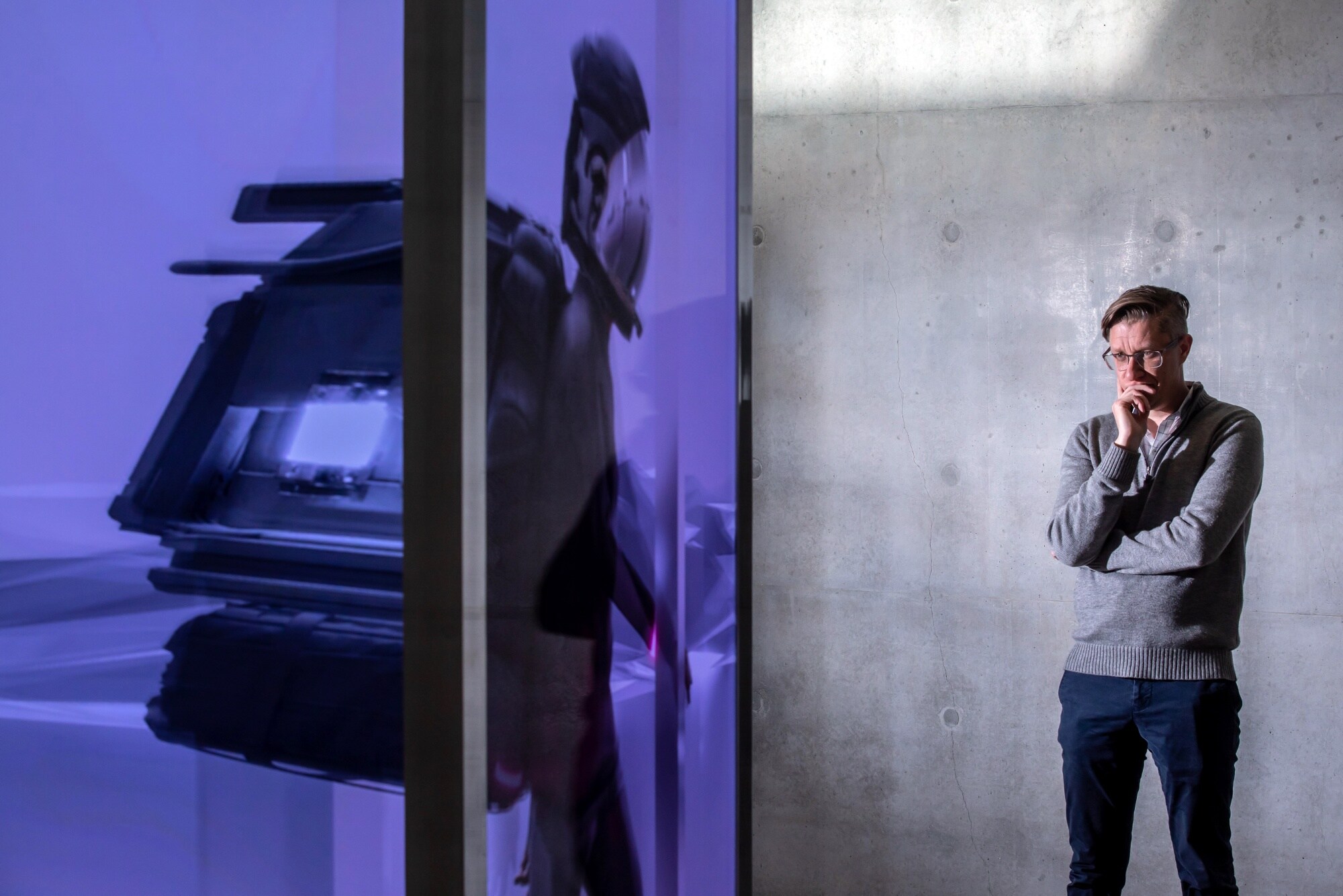 Artist Mike Winkelmann, who goes by the name Beeple, next to his NFT titled Everydays: The First 5000 Days.Photographer: Paul Yeung/Bloomberg