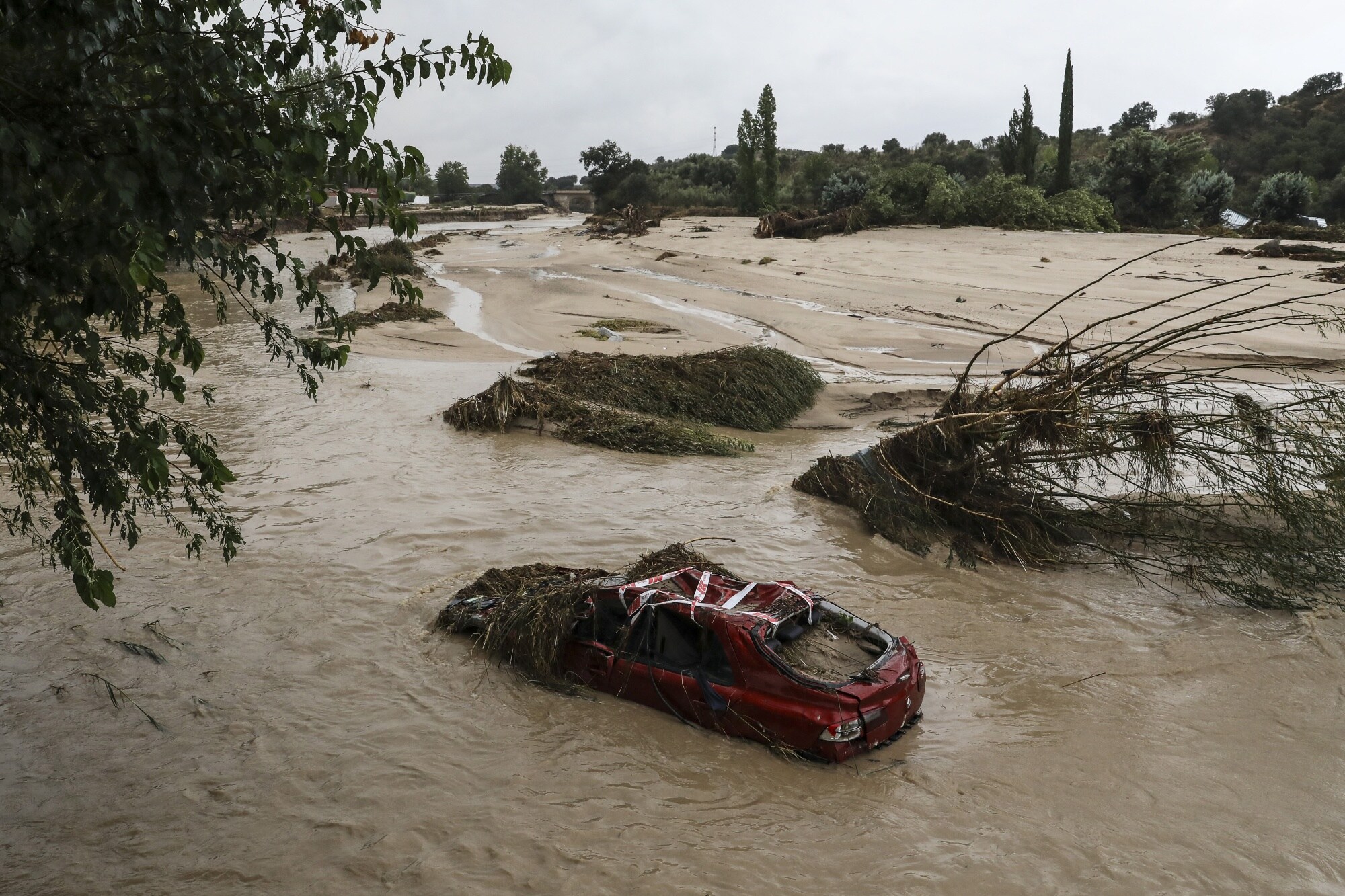 A car in a river following heavy rain in Villamanta, Madrid region, on Sept. 4.Photographer: Pablo Blazquez Dominguez/Getty Images
