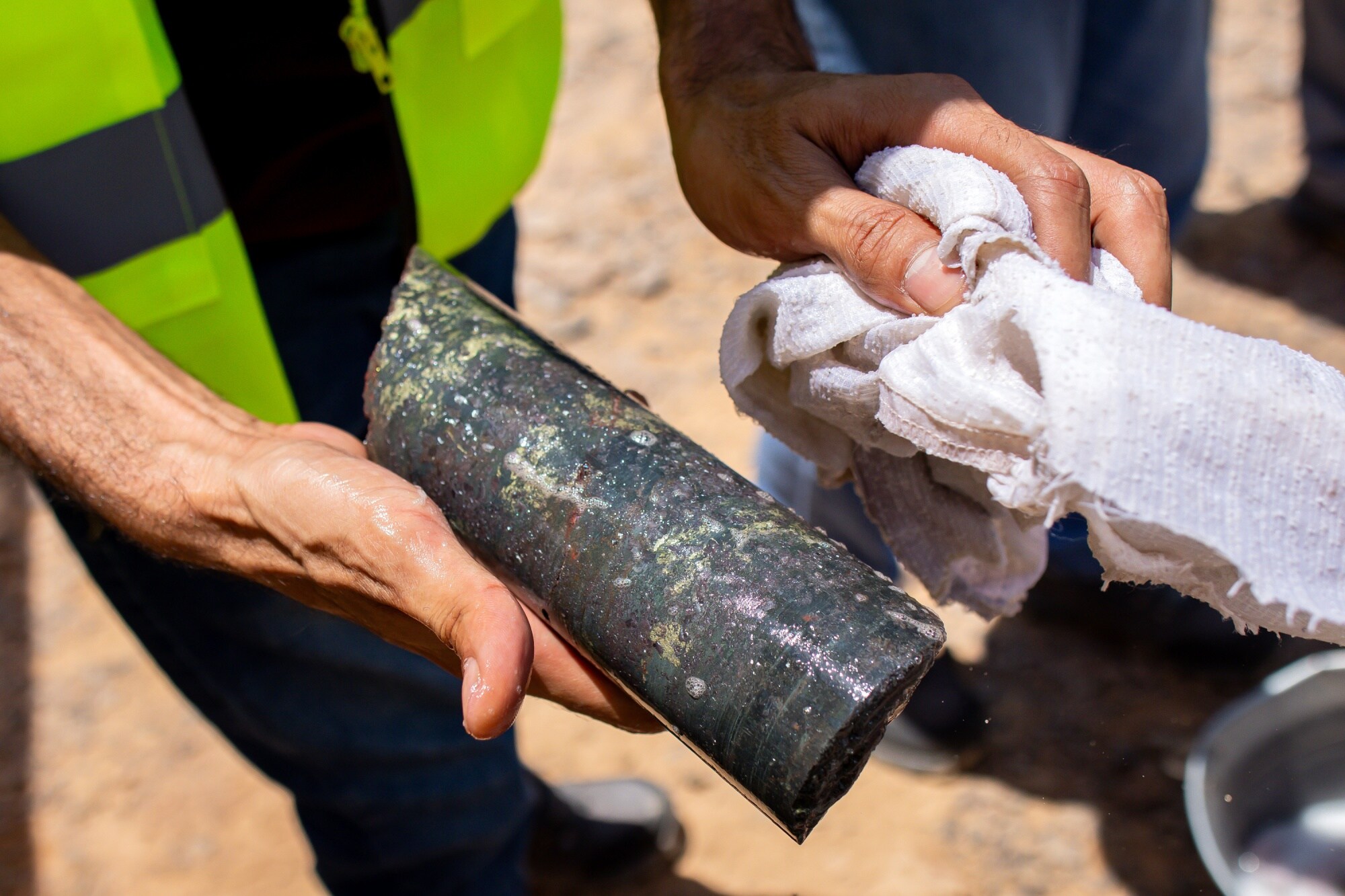Renier Swiegers displays a geological sample at the drill site.Photographer: Tasneem Alsultan/Bloomberg