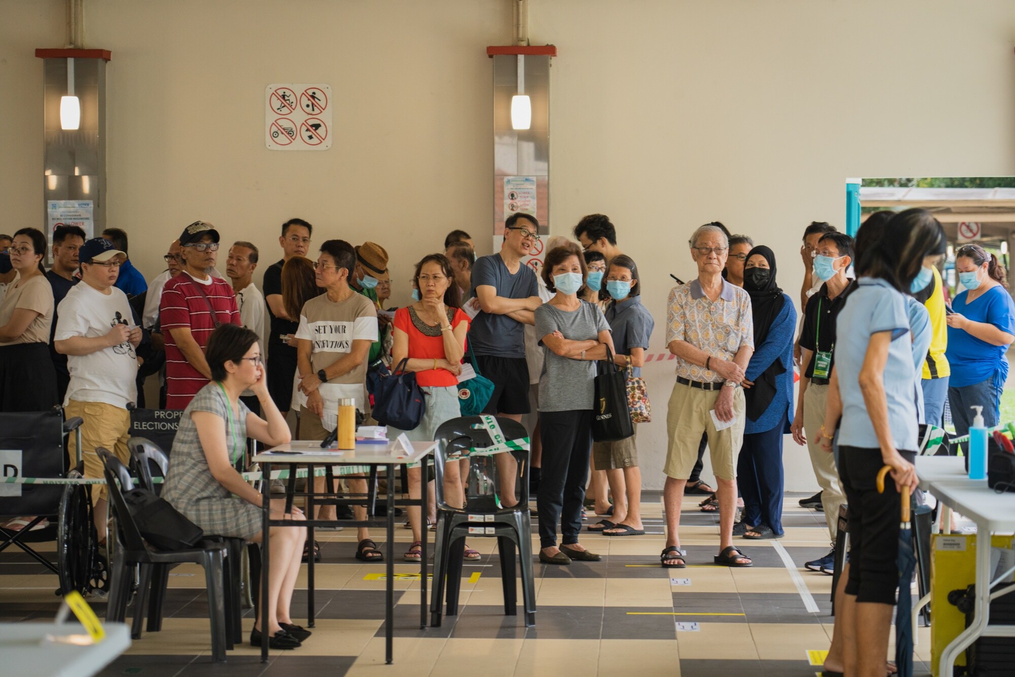 Voters queue at a polling station during the presidential election in Singapore, on Friday, Sept. 1, 2023. Singaporeans began voting for a new president for the first time in over a decade, posing a test for the ruling party challenged by higher living costs and political scandals.Photographer: Nicky Loh/Bloomberg