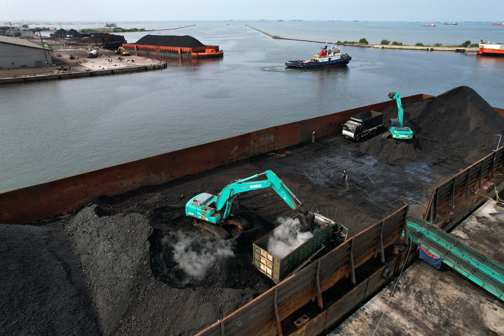 Coal at Cirebon Port in West Java. A power plant there is a candidate for early retirement. Photographer: Dimas Ardian/Bloomberg