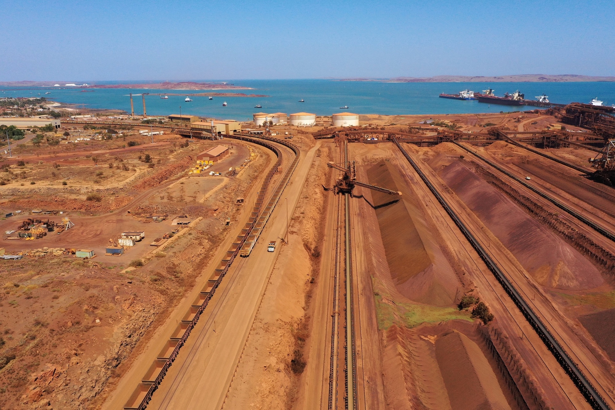 Iron ore stockpiles at a Rio Tinto port facility near Karratha, Western Australia, on Oct. 20.Photographer: Carla Gottgens/Bloomberg