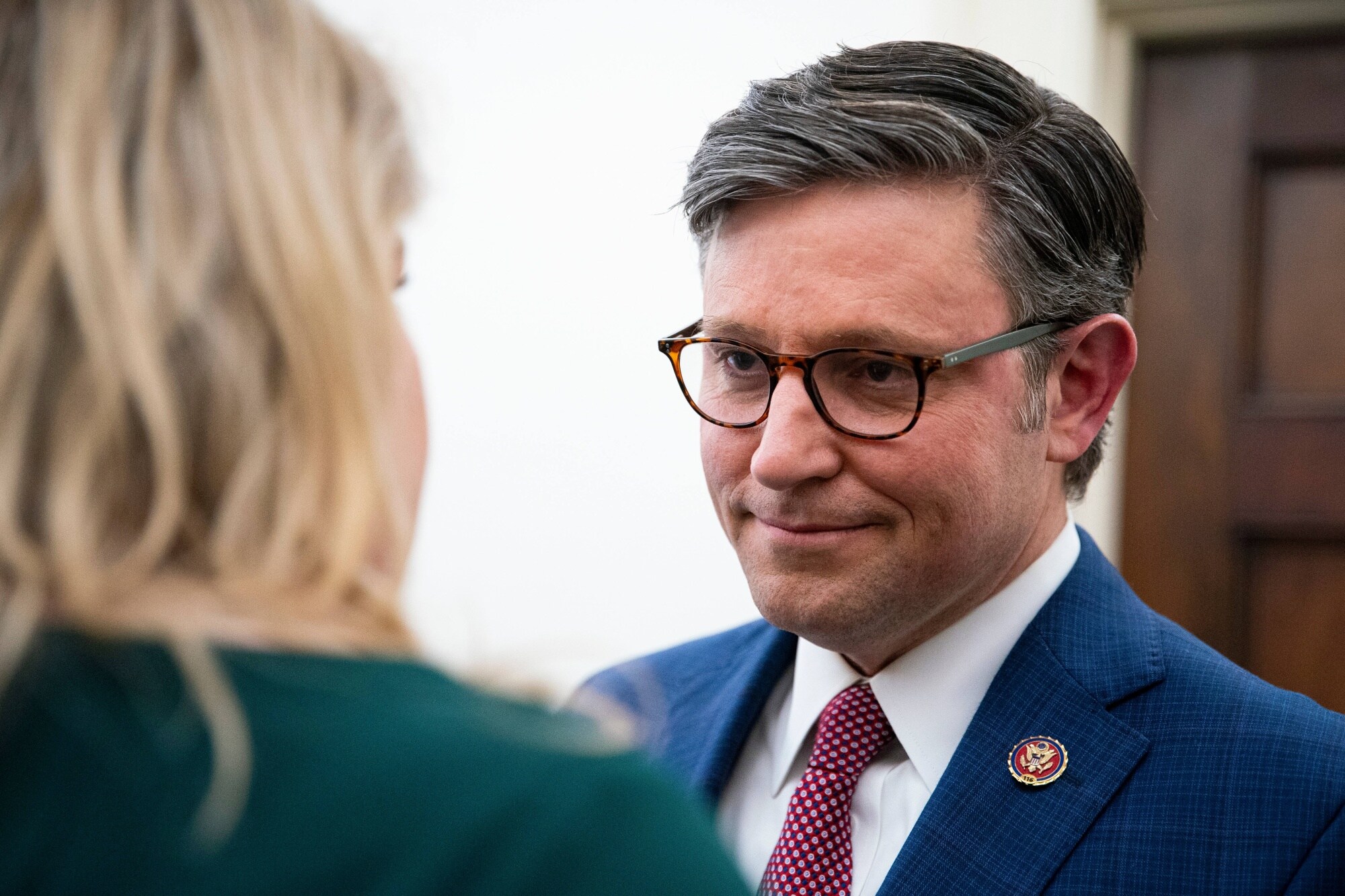 Representative Mike Johnson, right, speaks with Representative Kat Cammack outside of a House Republican caucus meeting on Tuesday. Photographer: Al Drago/Bloomberg