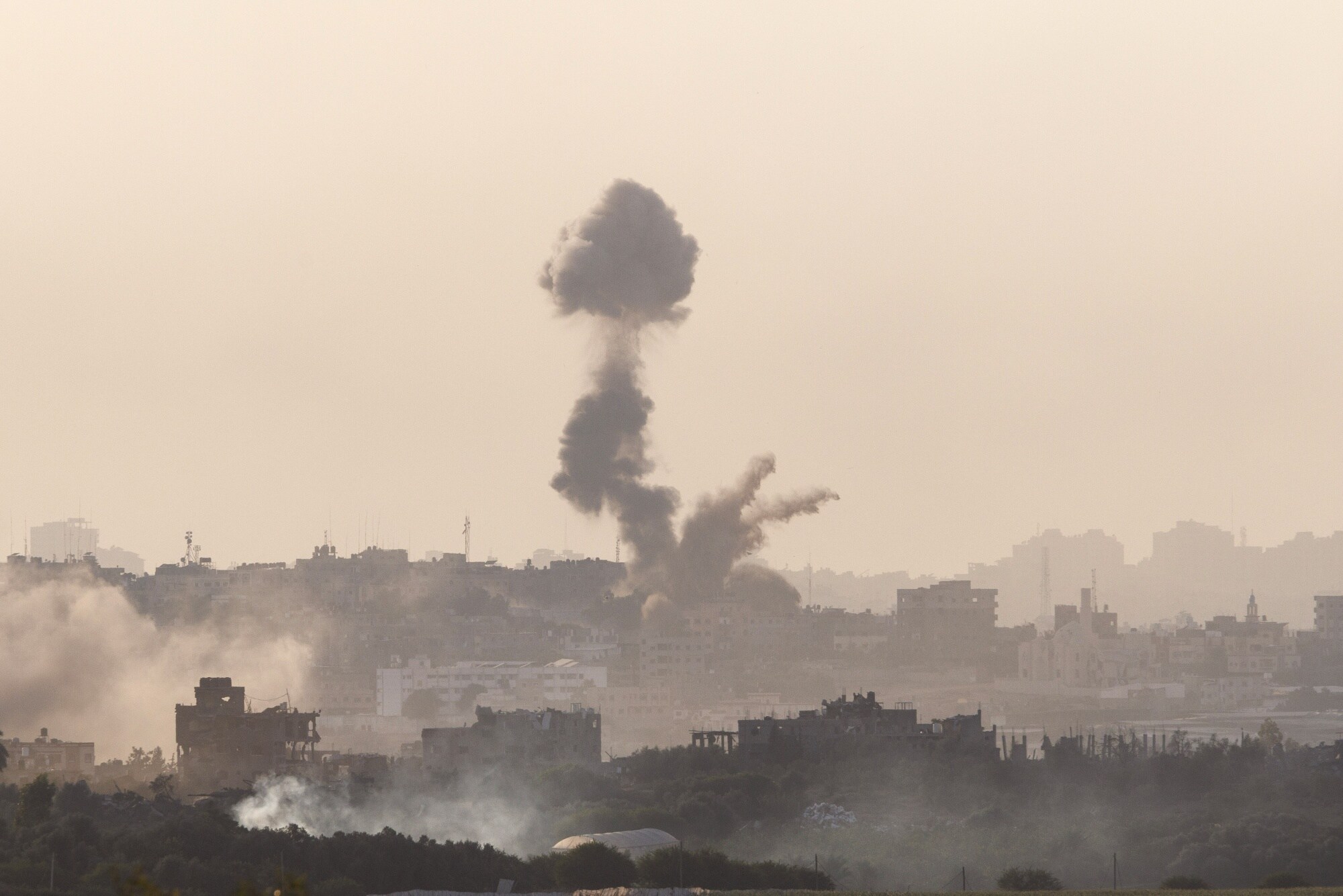 Smoke from destroyed buildings in the north of the Gaza Strip following Israeli air strikes, viewed from near Sderot, Israel, on Monday, Oct. 30, 2023.Photographer: Kobi Wolf/Bloomberg