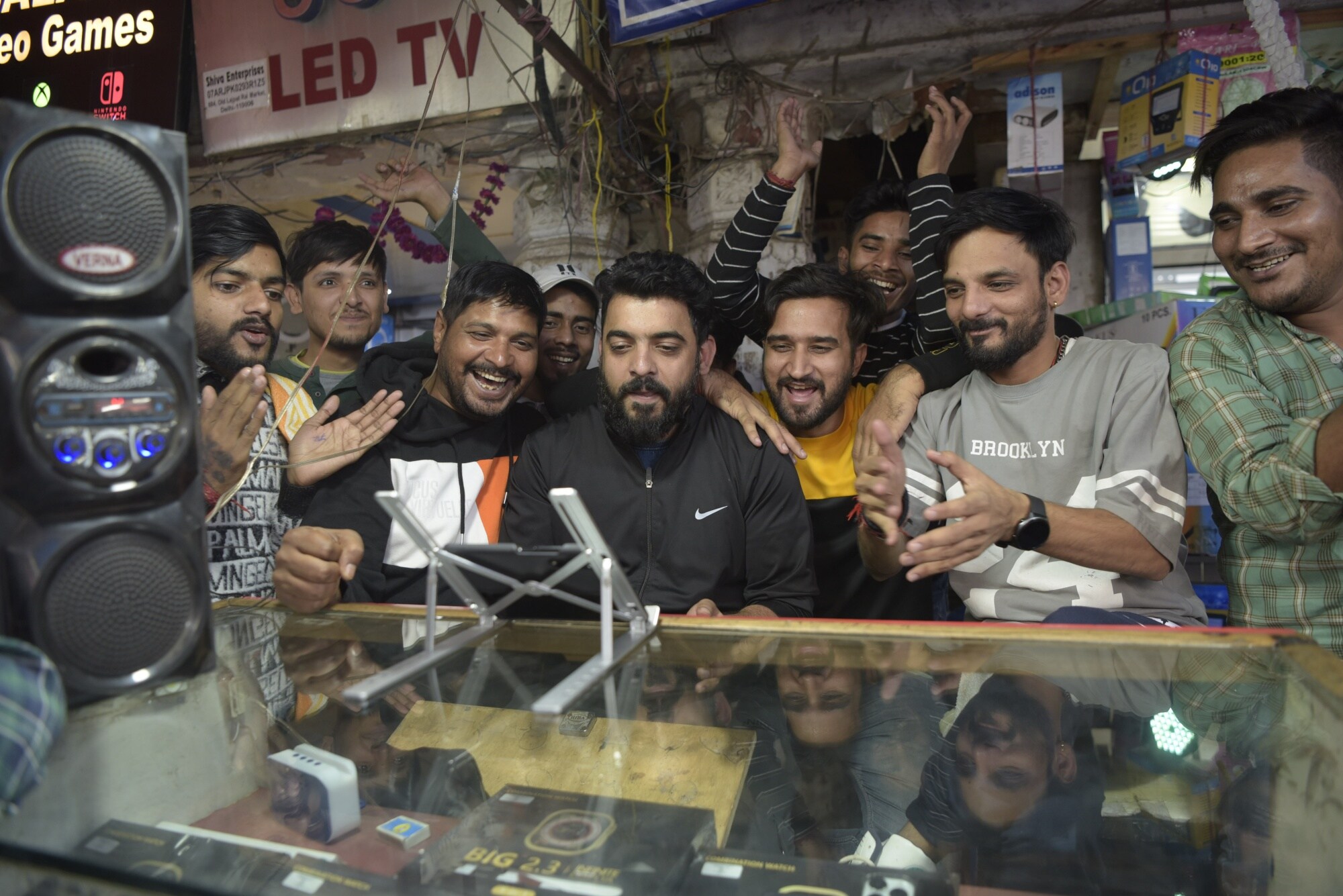Spectators react as they watch the ICC Men's Cricket World Cup 2023 final match between India and Australia, on a digital device at a store in Old Delhi, India, on Sunday, Nov. 19, 2023. Photographer: Saumya Khandelwal/Bloomberg