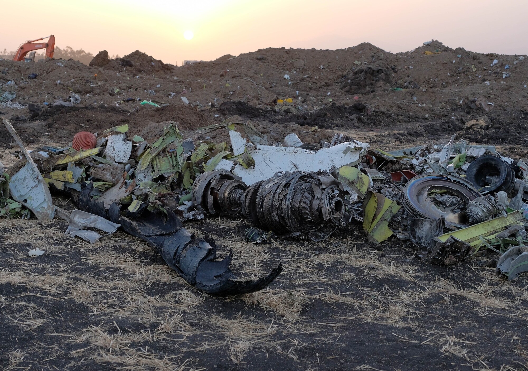 Parts of an engine and landing gear lie in a pile at the crash site of Ethiopian Airlines Flight 302 in Bishoftu, Ethiopia.Photographer: Jemal Countess/Getty Images