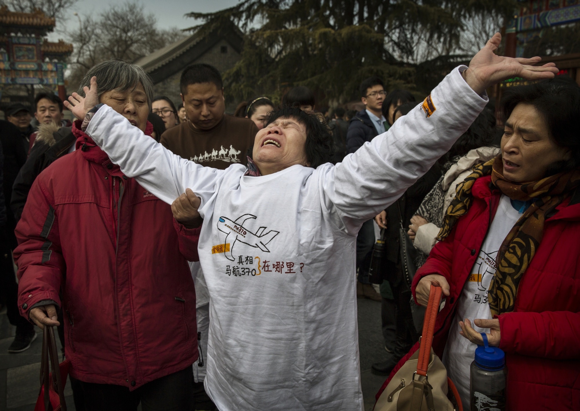 A relative of a missing passenger on MH370, in Beijing, on the one year anniversary of the aircraft vanishing. Photographer: Kevin Frayer/Getty Images