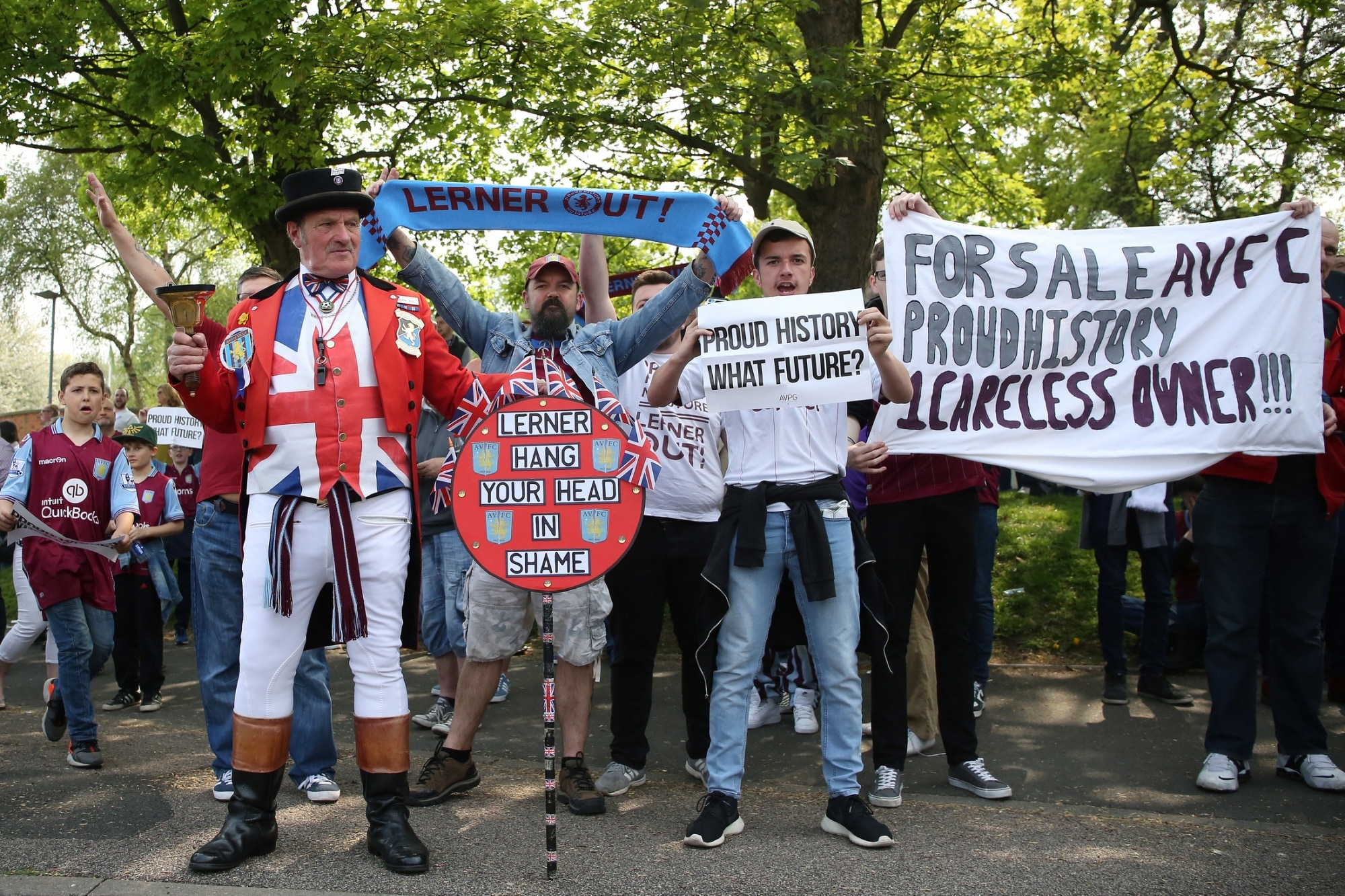 Aston Villa fans protest against owner Randy Lerner before a match in Birmingham in May 2016. Lerner sold the club following the team's relegation from the Premier League that month.Photographer: James Baylis/AMA/Getty Images