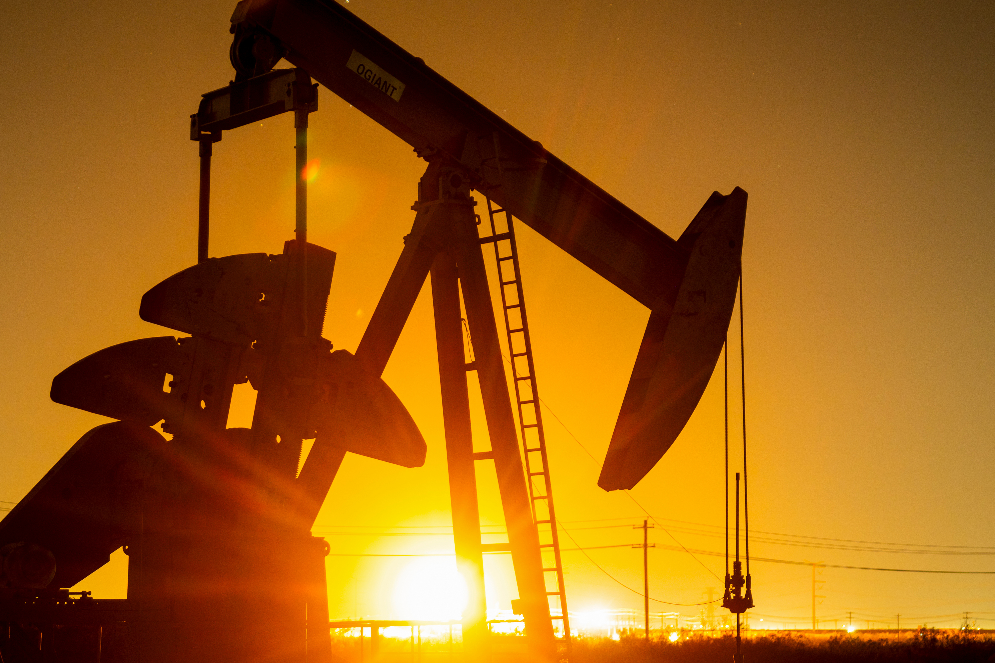 Oil Slides To Four-Year Low On Hit From Tariffs And OPEC Supply