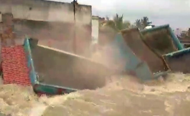 On Camera, House Collapses Into Flooded Canal Minutes After Evacuation