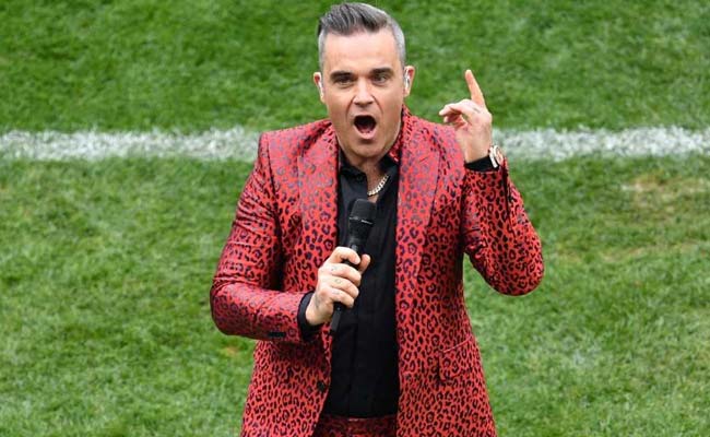 Football World Cup Kicks Off With Robbie Williams' Obscene Gesture