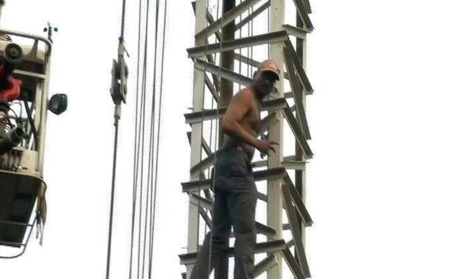 Man Threatens To Jump Off 300-Feet Tall Crane In Delhi