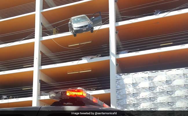 Car Hangs From 4th Floor Parking. Driver Hit Accelerator By Mistake
