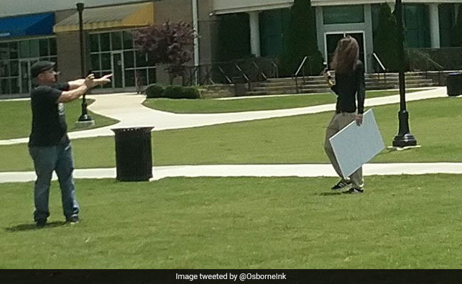 Man Arrested After Shouting 'Womp,Womp' And Pulling Out Gun On Protestors