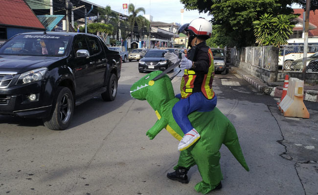 Cop Dons T-Rex Costume To Teach Traffic Safety Lessons
