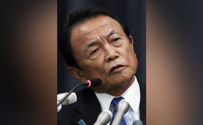 Japan Minister Taro Aso Returns Year's Salary Over Scandal Involving PM Shinzo Abe