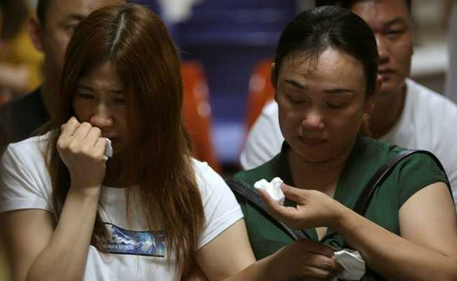 Chinese Relatives Wait For News After Thai Tourist Boat Sinking