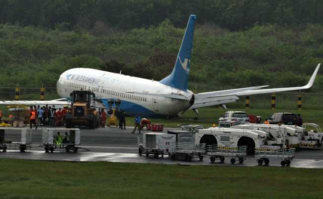 Passenger Plane Slides Off Runway In Heavy Rain