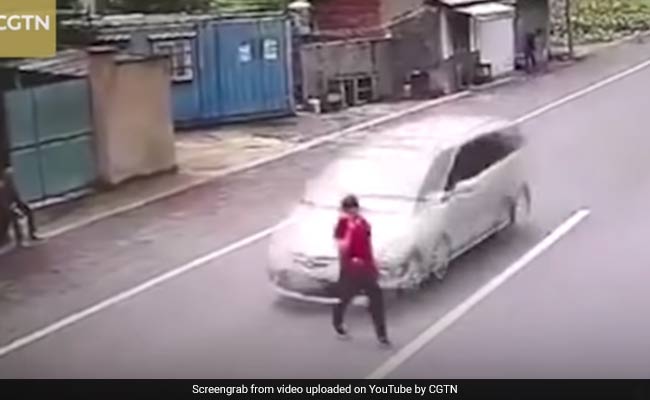 Speeding Car Grazes Woman Crossing Road. All She Loses Is Her Shoe, Phone